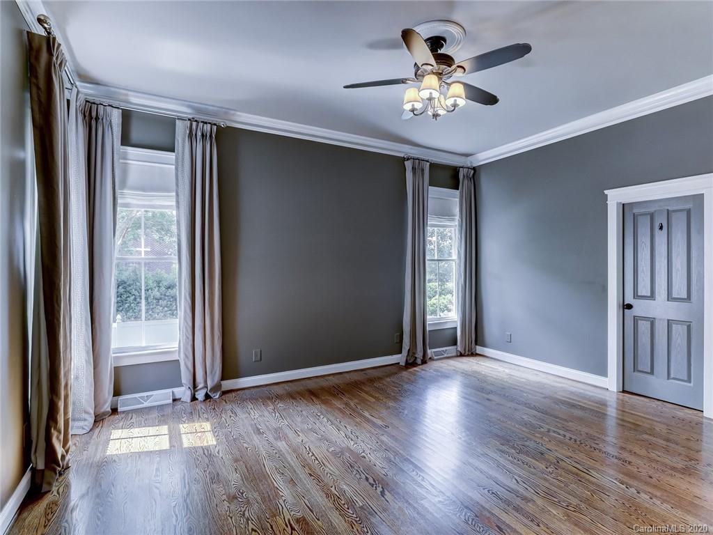317 Third Baxter Street Fort Mill, SC 29708 - Photo 24 of 48 an empty room with wooden floor chandelier fan and windows