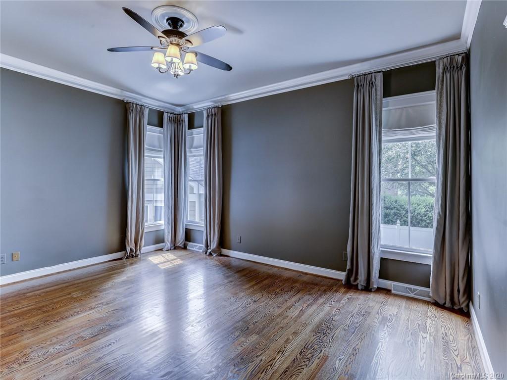 317 Third Baxter Street Fort Mill, SC 29708 - Photo 25 of 48 an empty room with wooden floor and windows