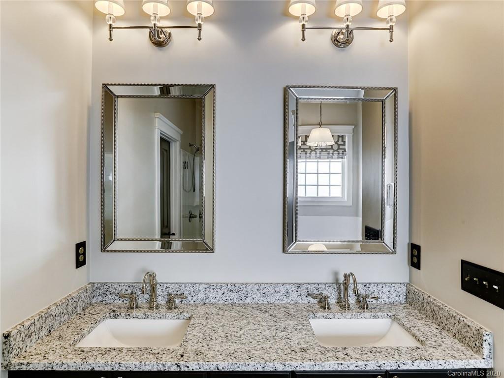 317 Third Baxter Street Fort Mill, SC 29708 - Photo 27 of 48 a bathroom with double vanity sinks and a mirror