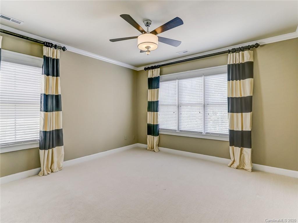 317 Third Baxter Street Fort Mill, SC 29708 - Photo 35 of 48 an empty room with windows and ceiling fan