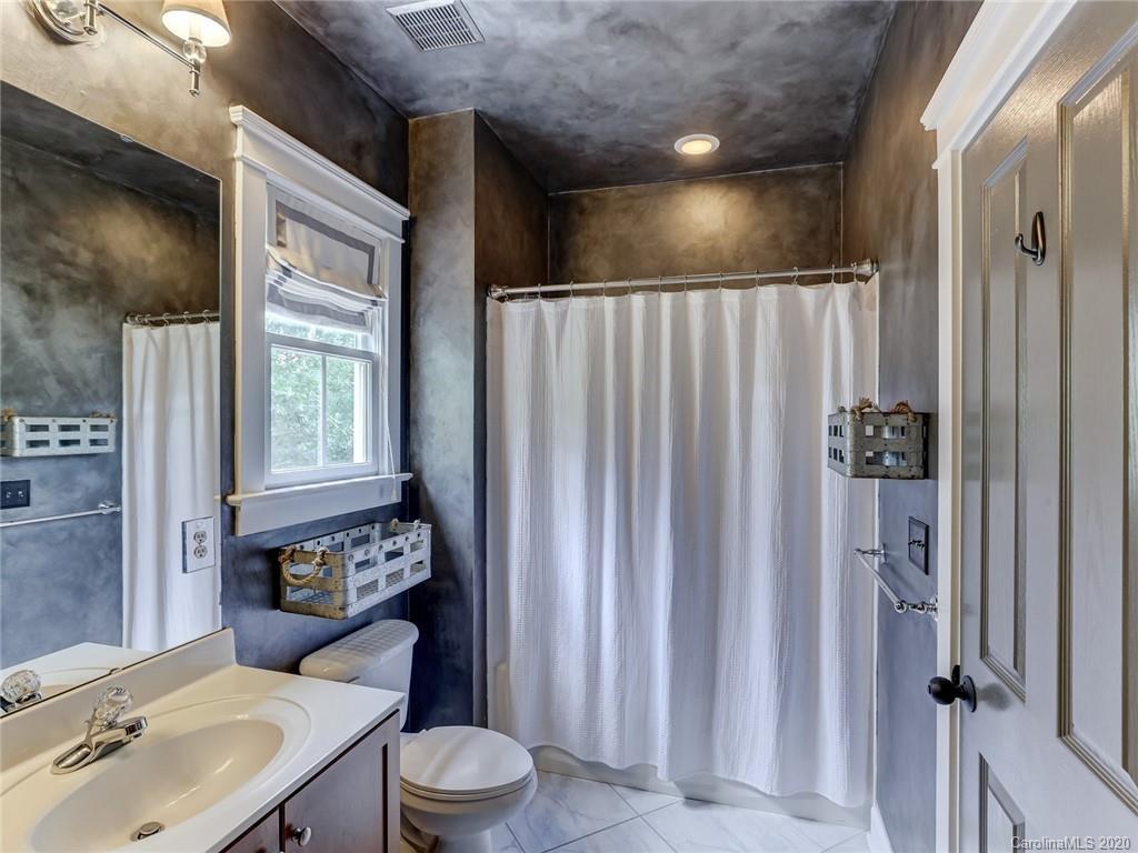 317 Third Baxter Street Fort Mill, SC 29708 - Photo 39 of 48 a bathroom with a toilet a sink and shower curtain