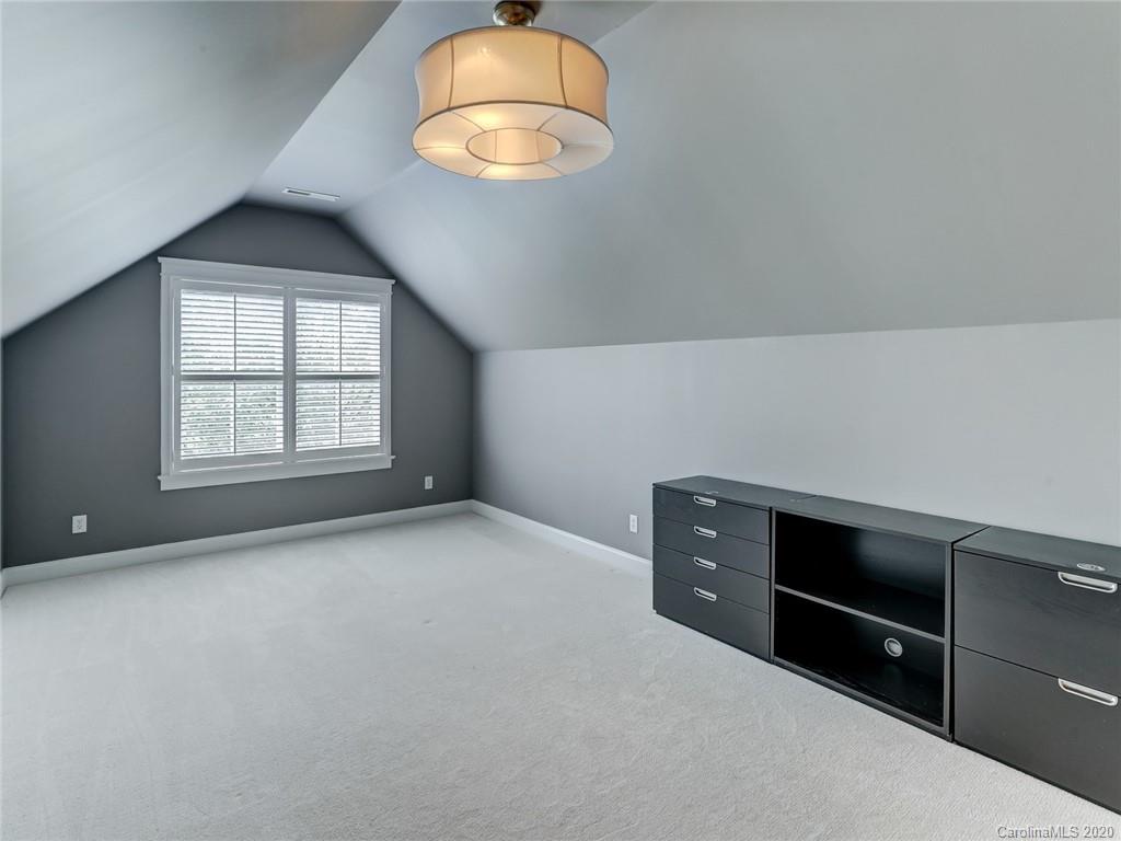 317 Third Baxter Street Fort Mill, SC 29708 - Photo 40 of 48 an empty room with windows and chandelier