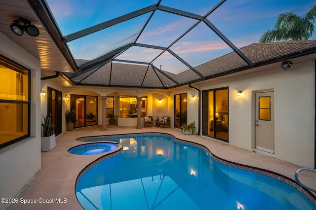 a view of a swimming pool with a porch