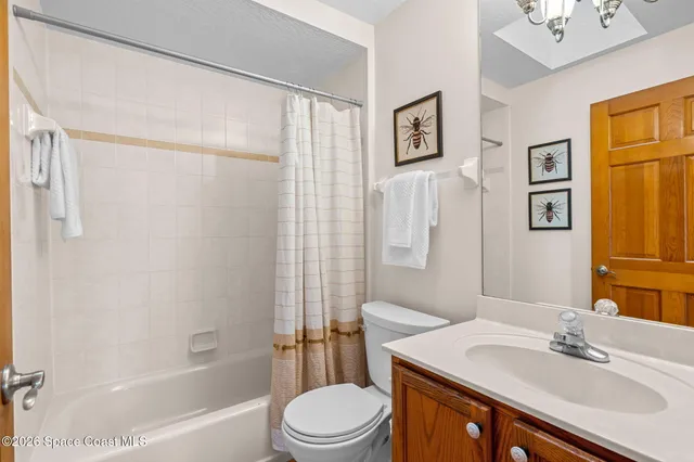 a view of a backyard with table and chairs under an umbrella