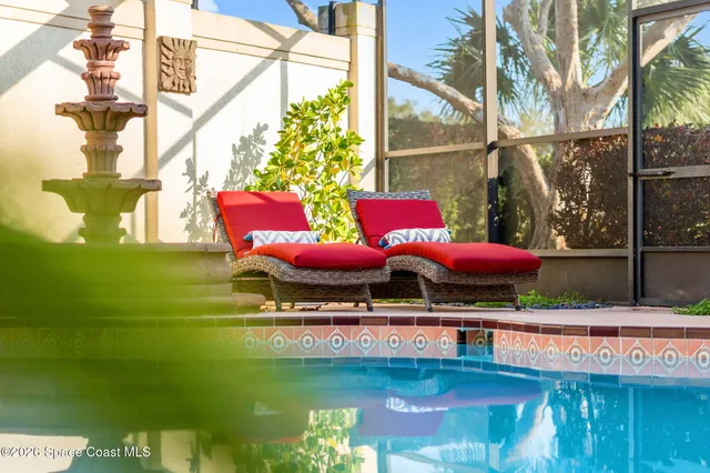 a view of a backyard with plants and a patio