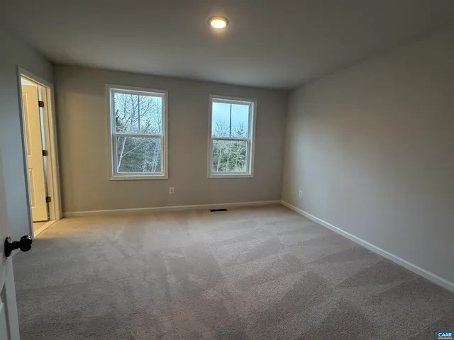 a bathroom with a shower a toilet and a sink