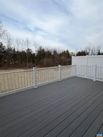 a view of a house with wooden deck