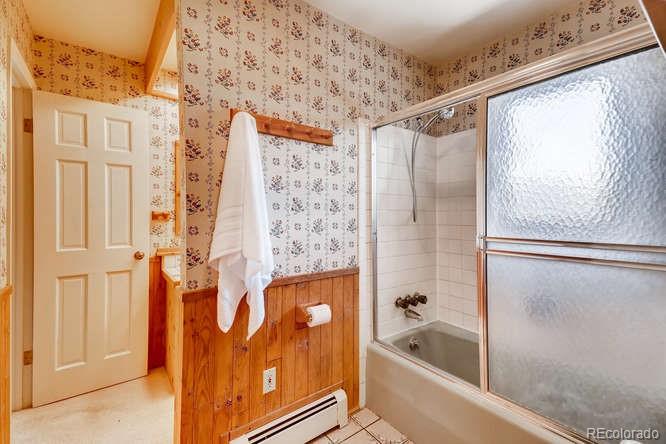 501 Peakview Road Boulder, CO 80302 - Photo 15 of 40 a bathroom with a bathtub and shower
