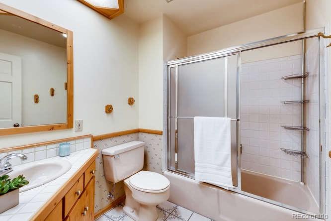 501 Peakview Road Boulder, CO 80302 - Photo 19 of 40 a bathroom with a sink toilet and shower