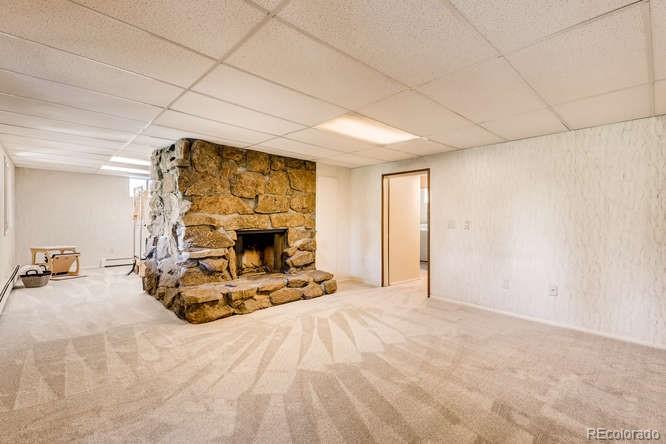 501 Peakview Road Boulder, CO 80302 - Photo 21 of 40 a view of a livingroom with furniture and a fireplace