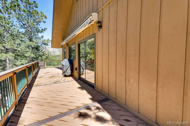 501 Peakview Road Boulder, CO 80302 - Photo 23 of 40 a view of balcony with wooden floor and stairs