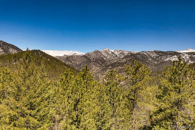 501 Peakview Road Boulder, CO 80302 - Photo 26 of 40 a view of mountain with lush green forest