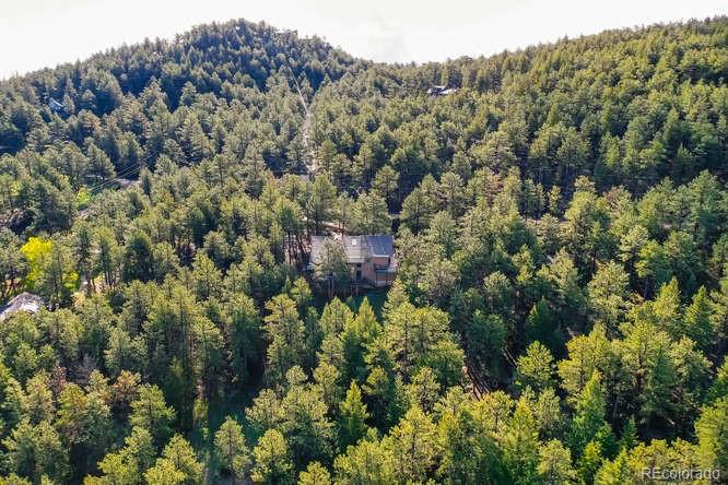 501 Peakview Road Boulder, CO 80302 - Photo 39 of 40 a view of a house in a forest