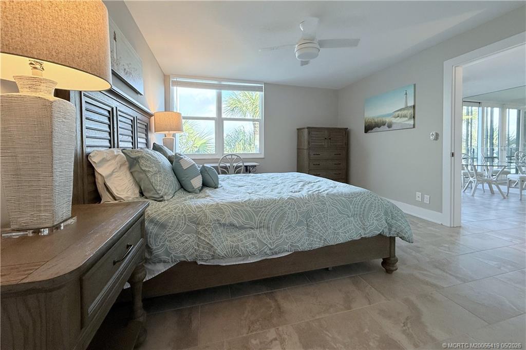 1950 Southwest Palm City Road, Unit 14305 Stuart, FL 34994 - Photo 34 of 70 a bedroom with a bed and window