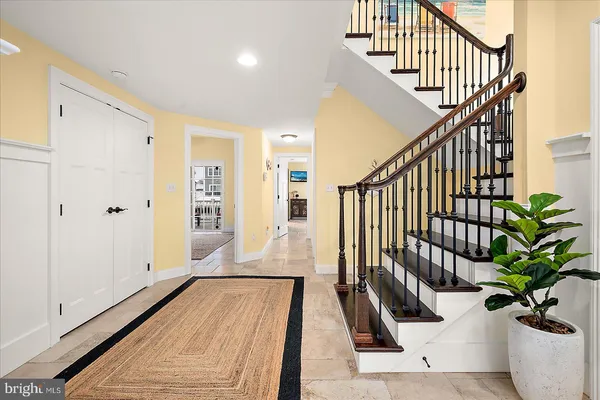 a kitchen with stainless steel appliances granite countertop a sink a stove and a wooden cabinets