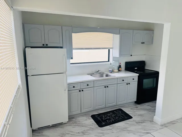 a bathroom with a sink a toilet and a bathtub