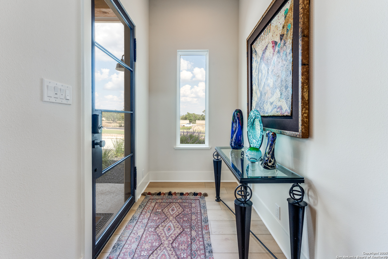 130 Saga Street Spring Branch, TX 78070 - Photo 11 of 49 a view of a hallway with wooden floor and windows