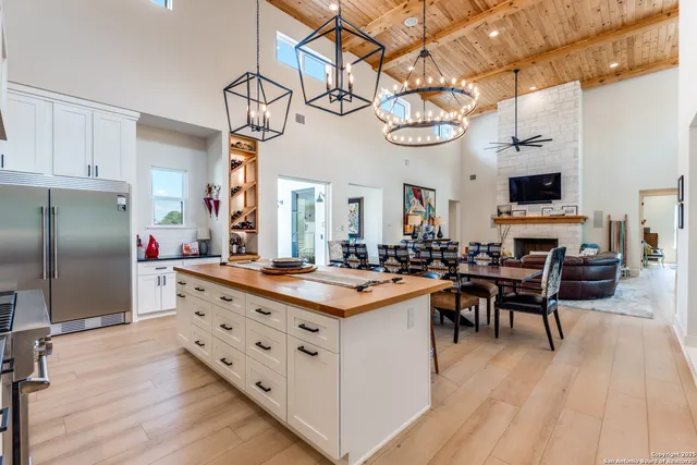 a hallway with cabinets and a wooden floor