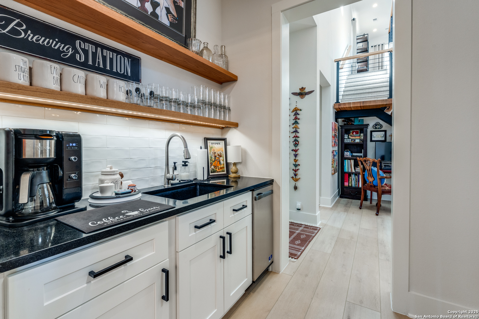 130 Saga Street Spring Branch, TX 78070 - Photo 20 of 49 a hallway with cabinets and a wooden floor