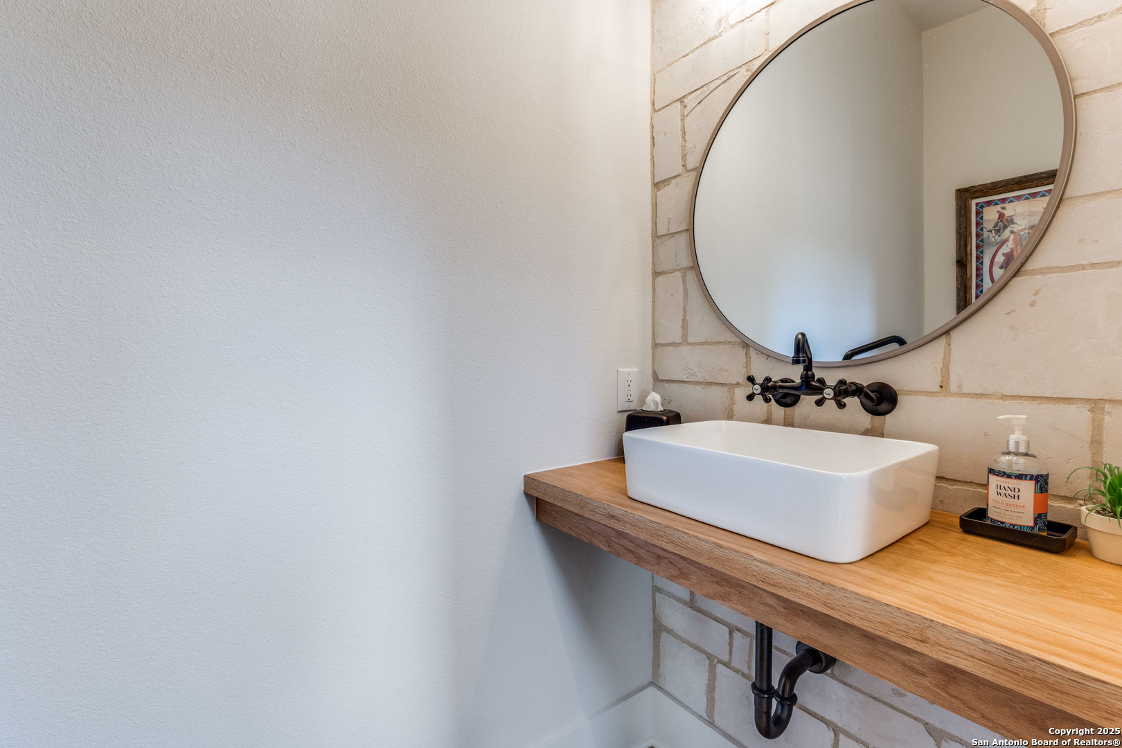 130 Saga Street Spring Branch, TX 78070 - Photo 28 of 49 a bathroom with a sink and mirror