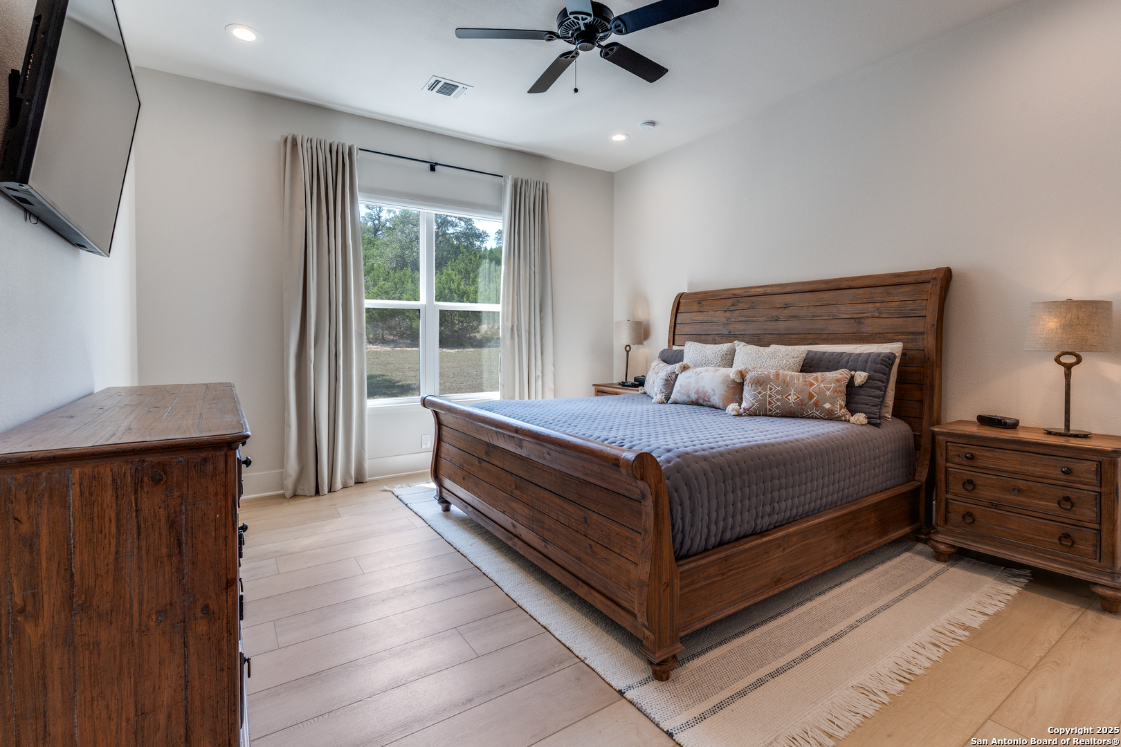 130 Saga Street Spring Branch, TX 78070 - Photo 29 of 49 a bedroom with a large bed and a window