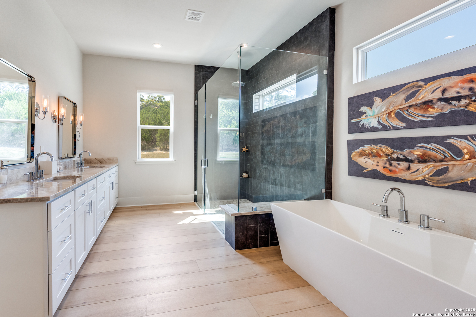 130 Saga Street Spring Branch, TX 78070 - Photo 30 of 49 a bathroom with a tub sink and mirror
