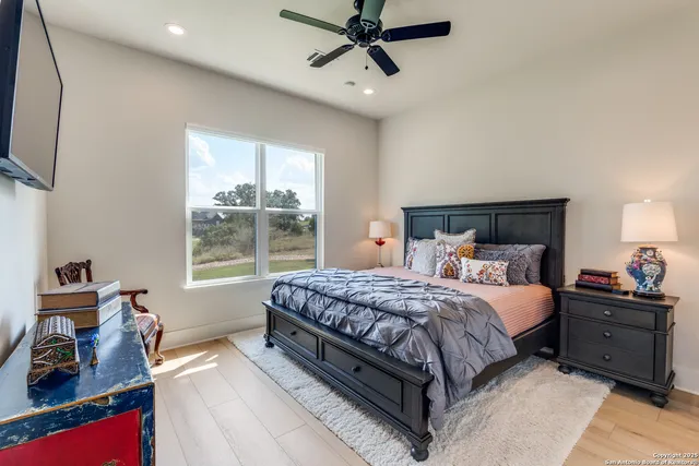 a bedroom with bed and window