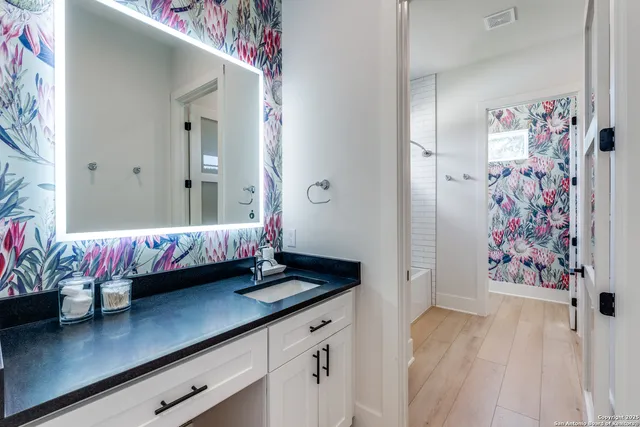 a bathroom with a bathtub and a shower