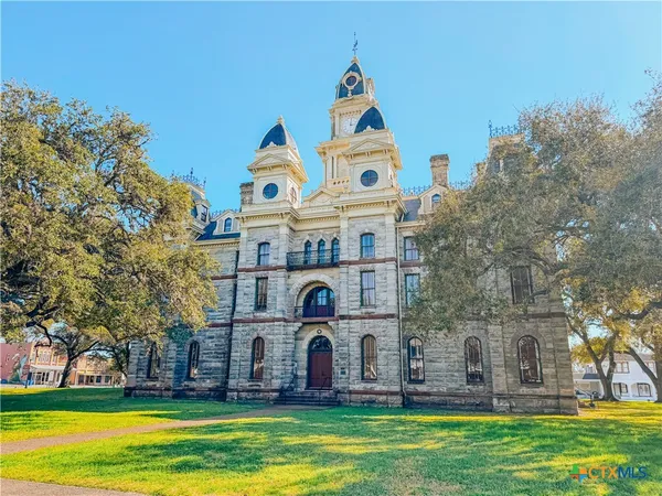 a view of a chairs and table in the patio