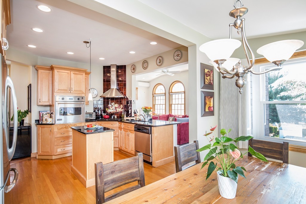 35 Winthrop Street Everett, MA 02149 - Photo 11 of 30 a kitchen with stainless steel appliances granite countertop sink stove top oven and cabinets