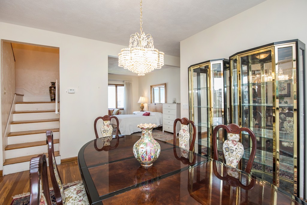 35 Winthrop Street Everett, MA 02149 - Photo 12 of 30 a view of a dining room with furniture wooden floor and chandelier
