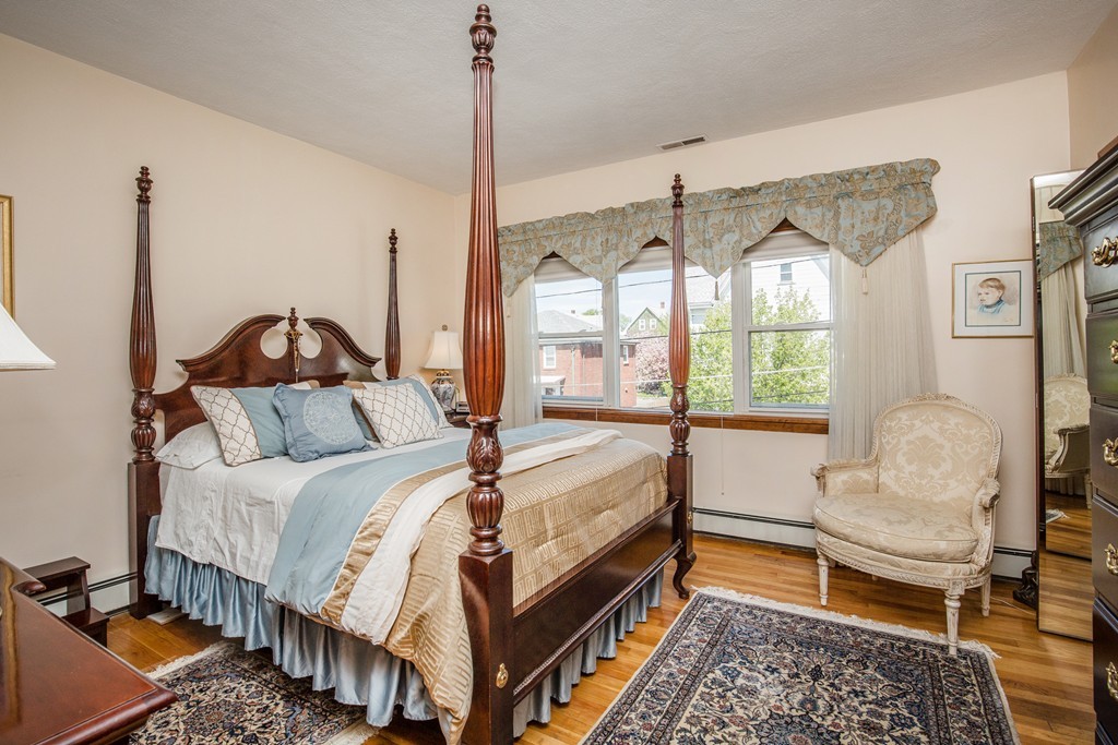 35 Winthrop Street Everett, MA 02149 - Photo 14 of 30 a bedroom with a bed chair and window
