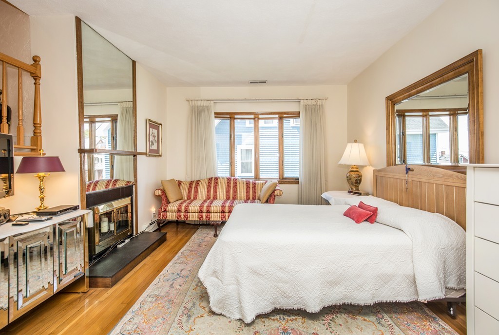 35 Winthrop Street Everett, MA 02149 - Photo 15 of 30 a bedroom with a bed and a large window