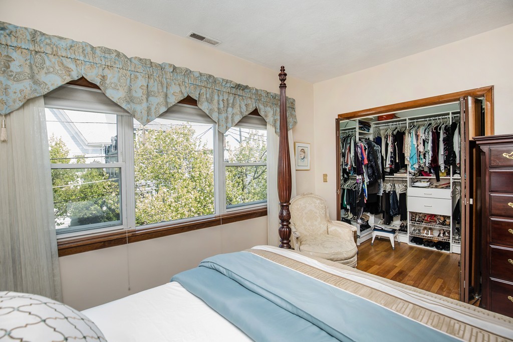 35 Winthrop Street Everett, MA 02149 - Photo 16 of 30 a room with a bed and a large window