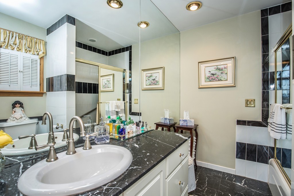 35 Winthrop Street Everett, MA 02149 - Photo 18 of 30 a bathroom with double vanity and a mirror