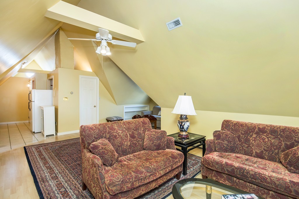35 Winthrop Street Everett, MA 02149 - Photo 20 of 30 a living room with furniture and a chandelier