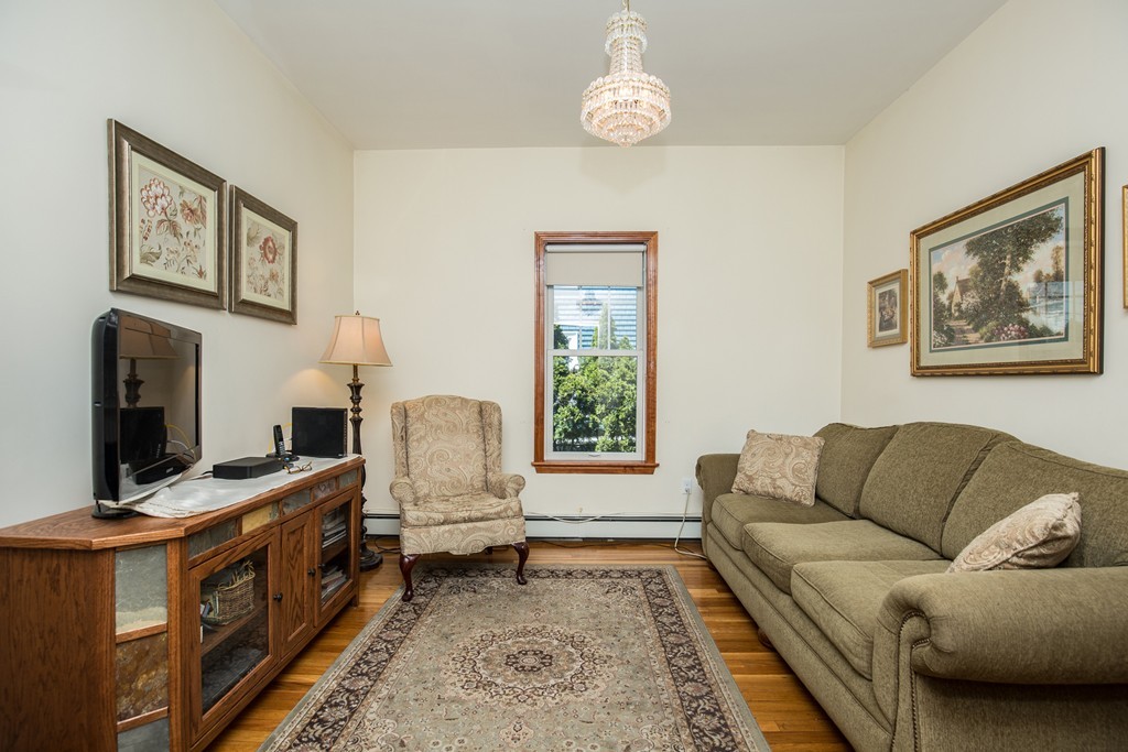 35 Winthrop Street Everett, MA 02149 - Photo 23 of 30 a living room with furniture and a flat screen tv
