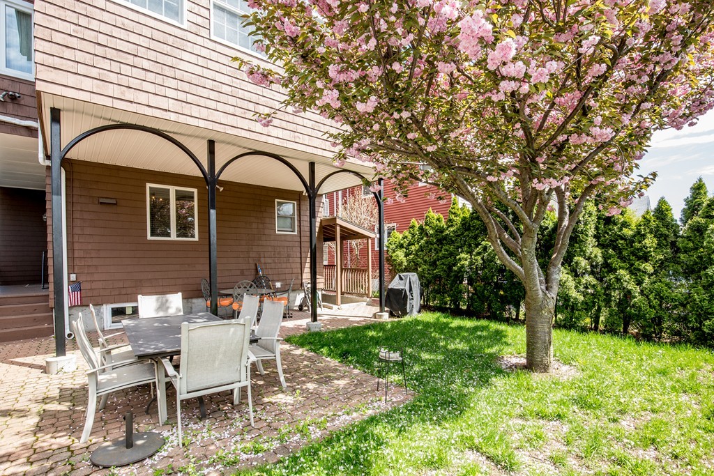 35 Winthrop Street Everett, MA 02149 - Photo 29 of 30 a front view of a house with garden