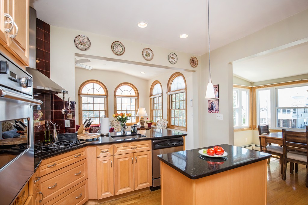 35 Winthrop Street Everett, MA 02149 - Photo 7 of 30 a kitchen with stainless steel appliances granite countertop a stove and a sink