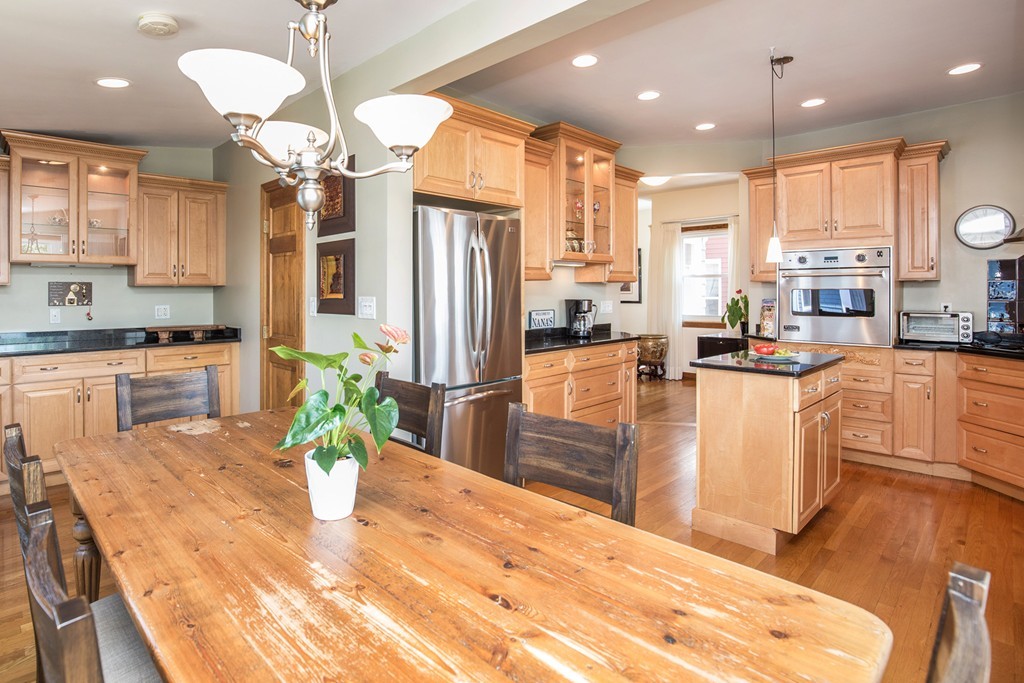 35 Winthrop Street Everett, MA 02149 - Photo 10 of 30 a dining room filled chandelier and kitchen view