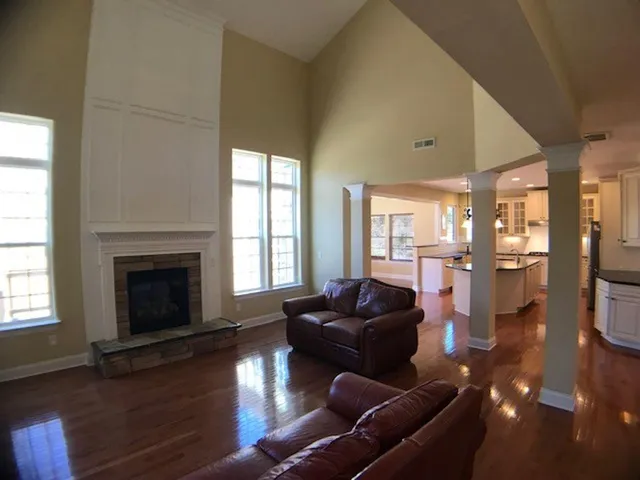 a living room with furniture window and a fireplace