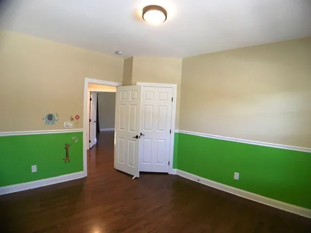 a view of room with window and stainless steel appliances