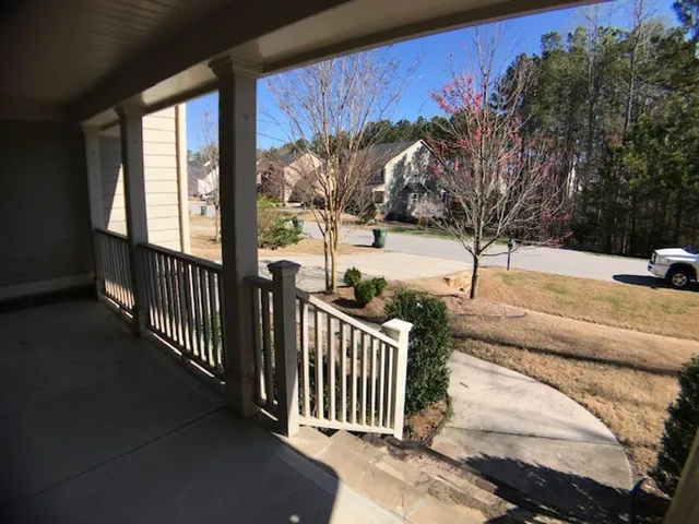 a view of a yard from a balcony
