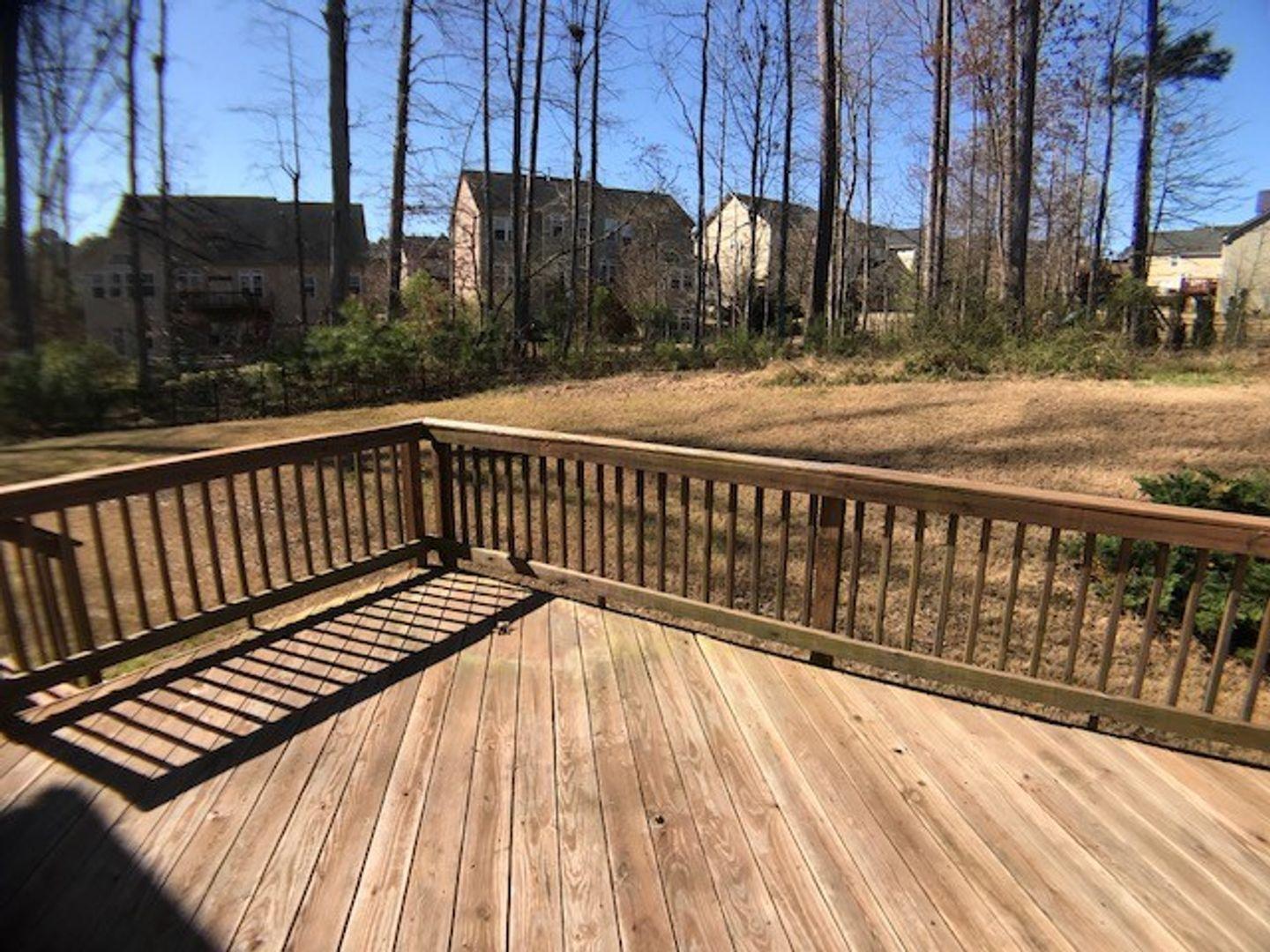 1120 Riggins Mill Road Cary, NC 27519 - Photo 33 of 34 a view of wooden balcony with outdoor space