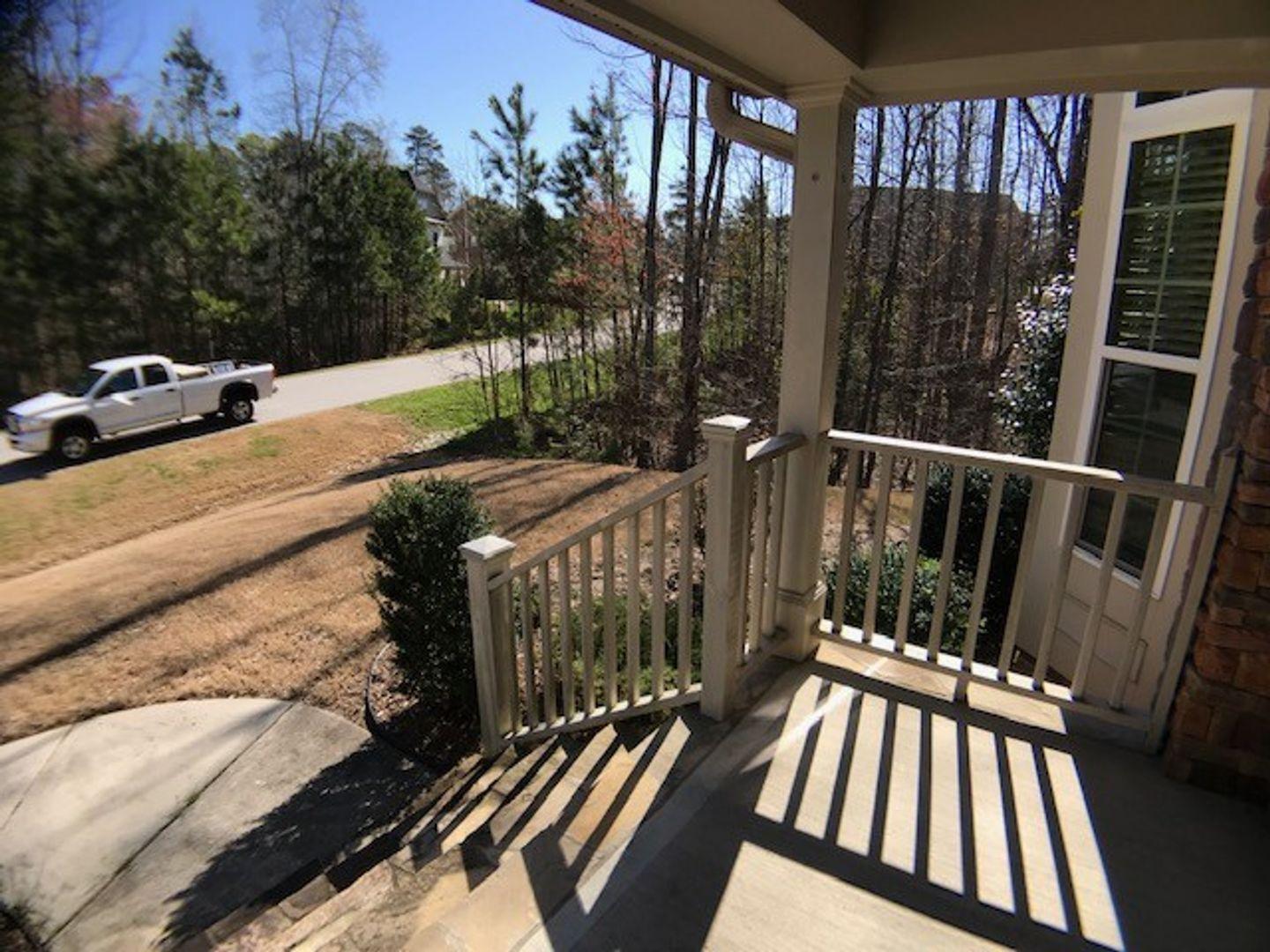 1120 Riggins Mill Road Cary, NC 27519 - Photo 4 of 34 a view of balcony with wooden floor and outdoor seating
