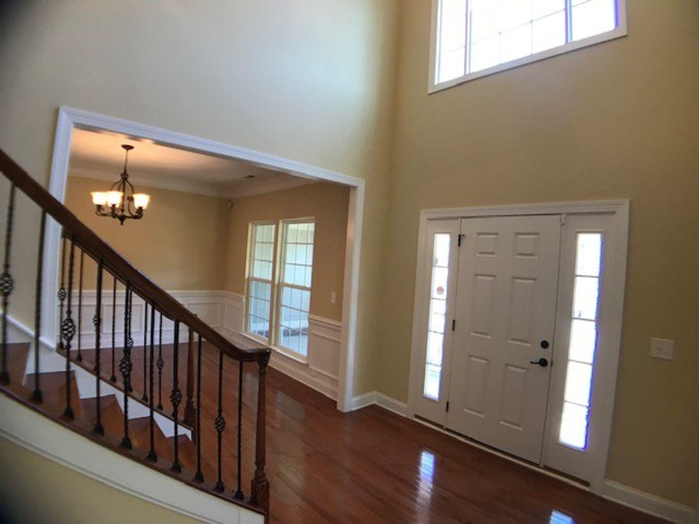 1120 Riggins Mill Road Cary, NC 27519 - Photo 5 of 34 a view of an entryway with wooden floor