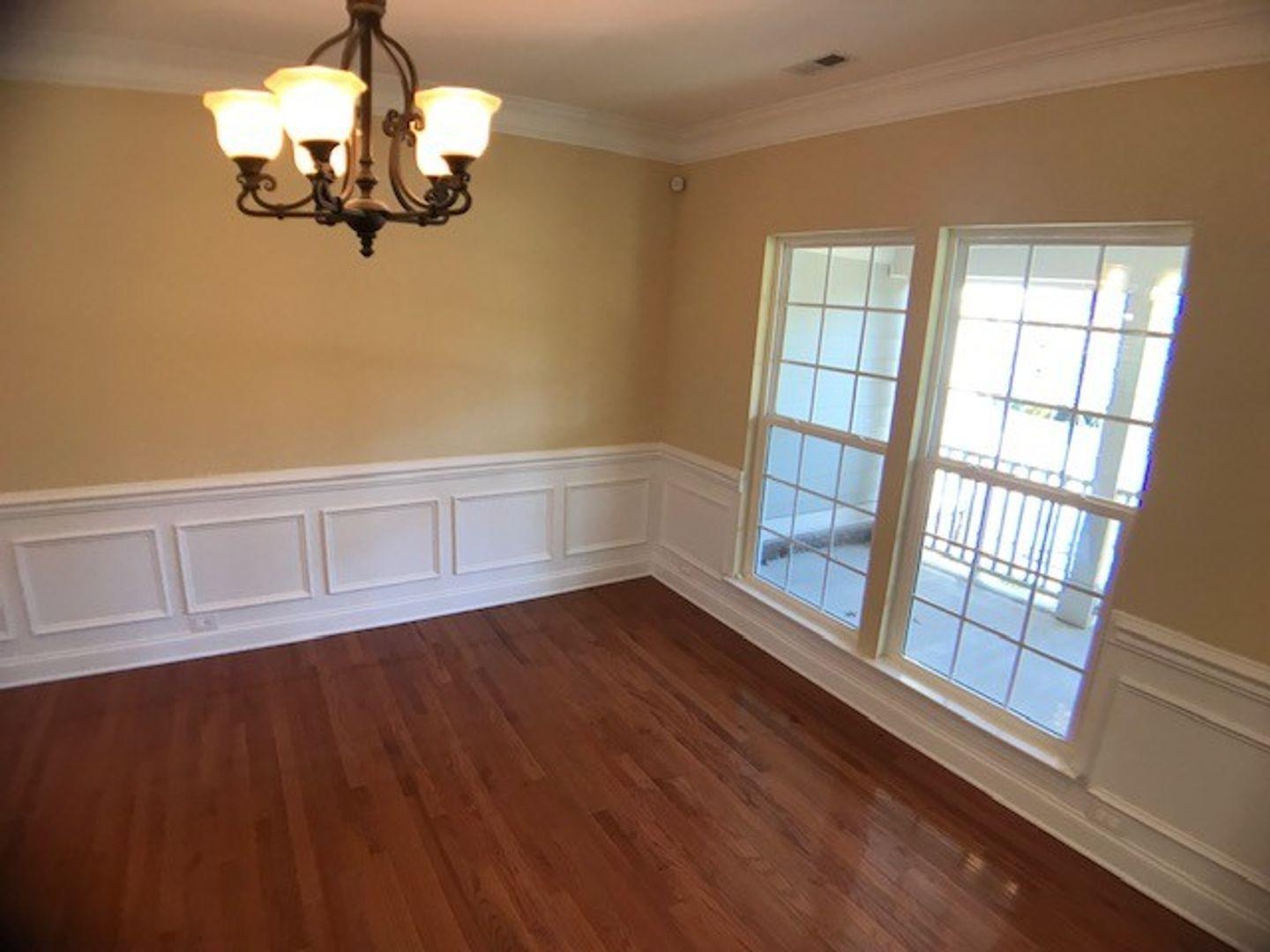 1120 Riggins Mill Road Cary, NC 27519 - Photo 9 of 34 wooden floor in an empty room with a window