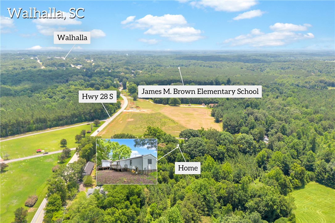 150 Newberry Road Walhalla, SC 29691 - Photo 42 of 47 An aerial perspective reveals the expansive, lush green landscape surrounding this secluded property.