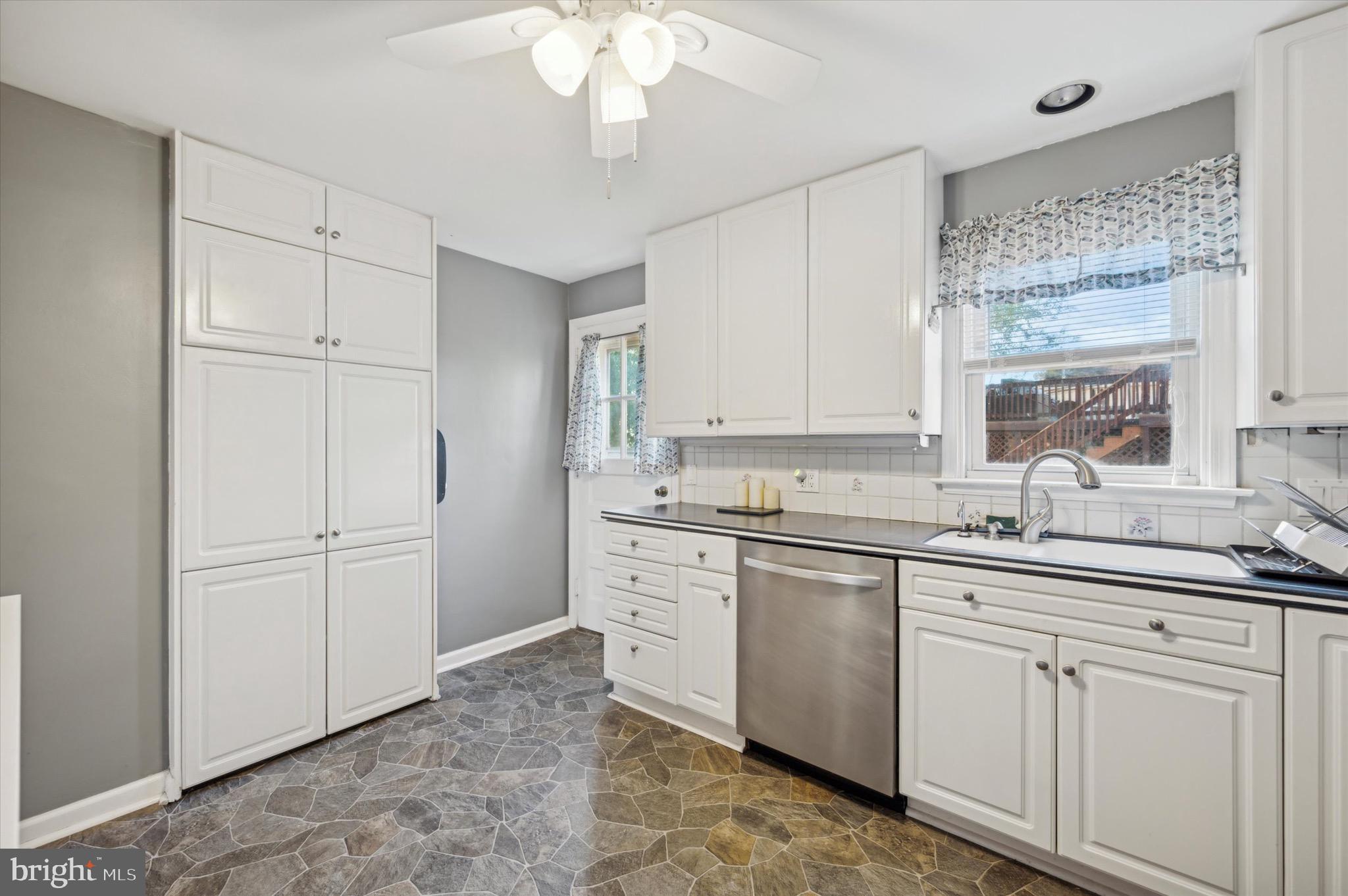 222 Fairhill Road Morton, PA 19070 - Photo 14 of 40 a kitchen with a sink and cabinets