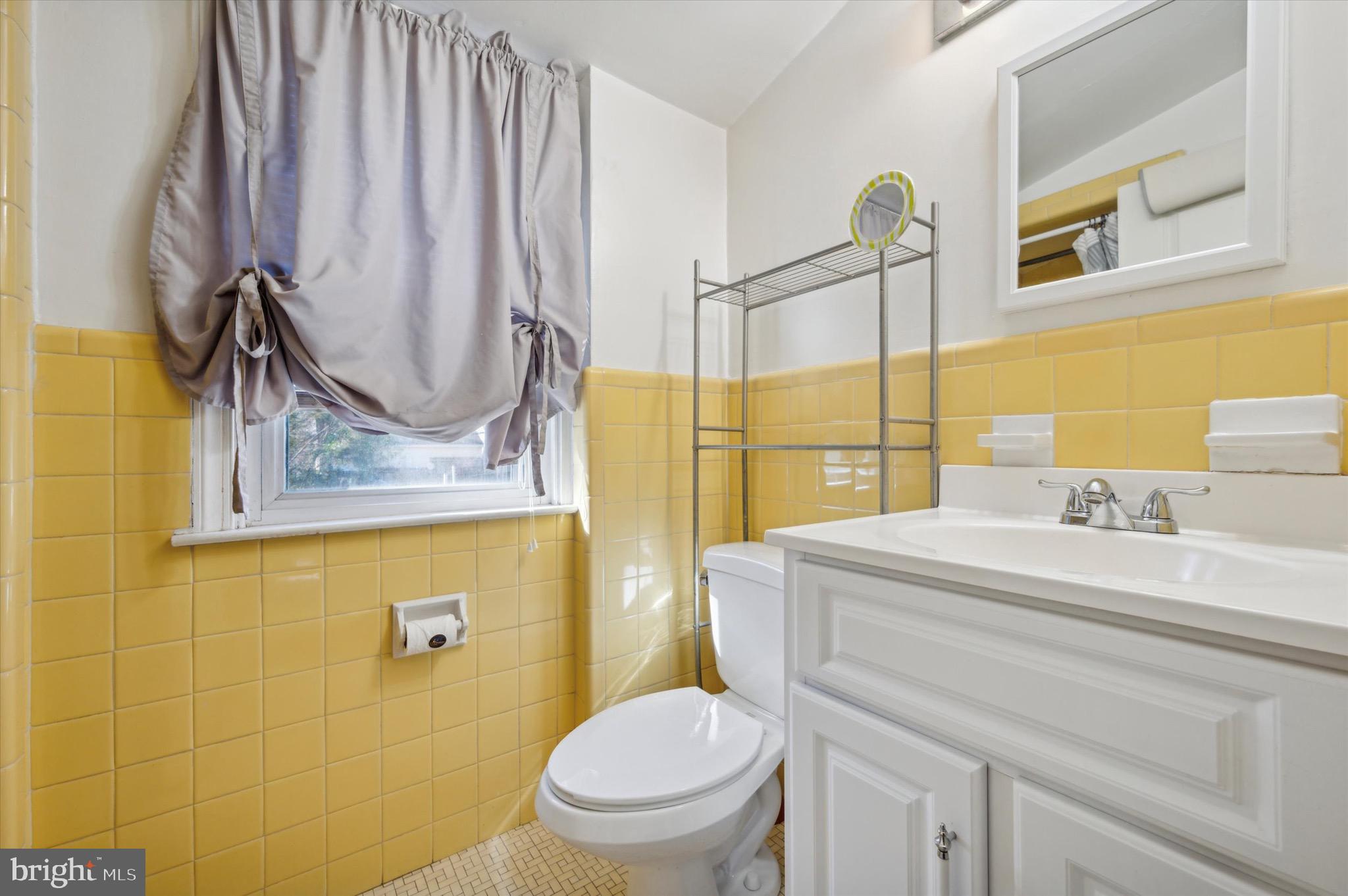 222 Fairhill Road Morton, PA 19070 - Photo 28 of 40 a bathroom with a sink a toilet and a mirror